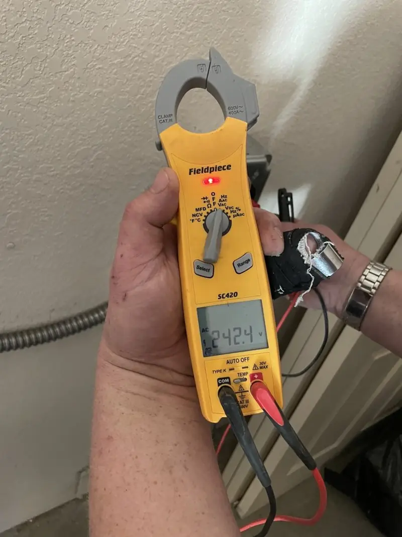 Voltage testing with clamp meter during Outlet Installation in Doylestown